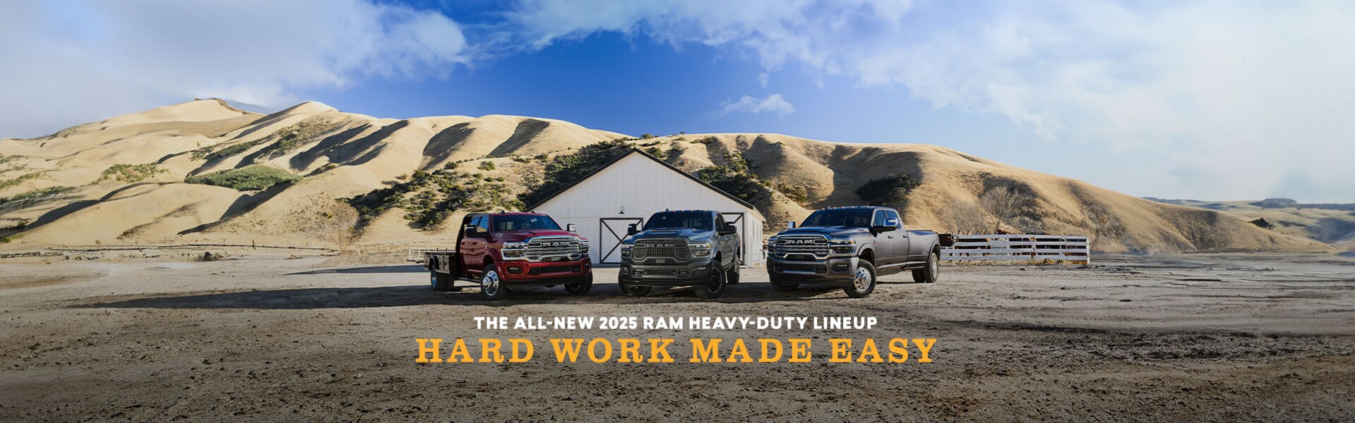 2025 Ram Heavy Duty Trucks in front of a barn