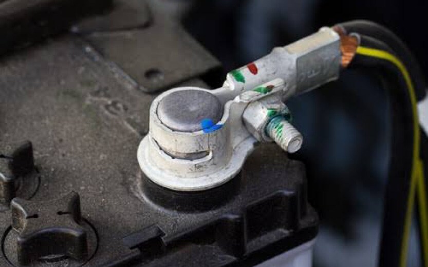 A close up of clean, shiny battery terminals free of white powdery corrosion.