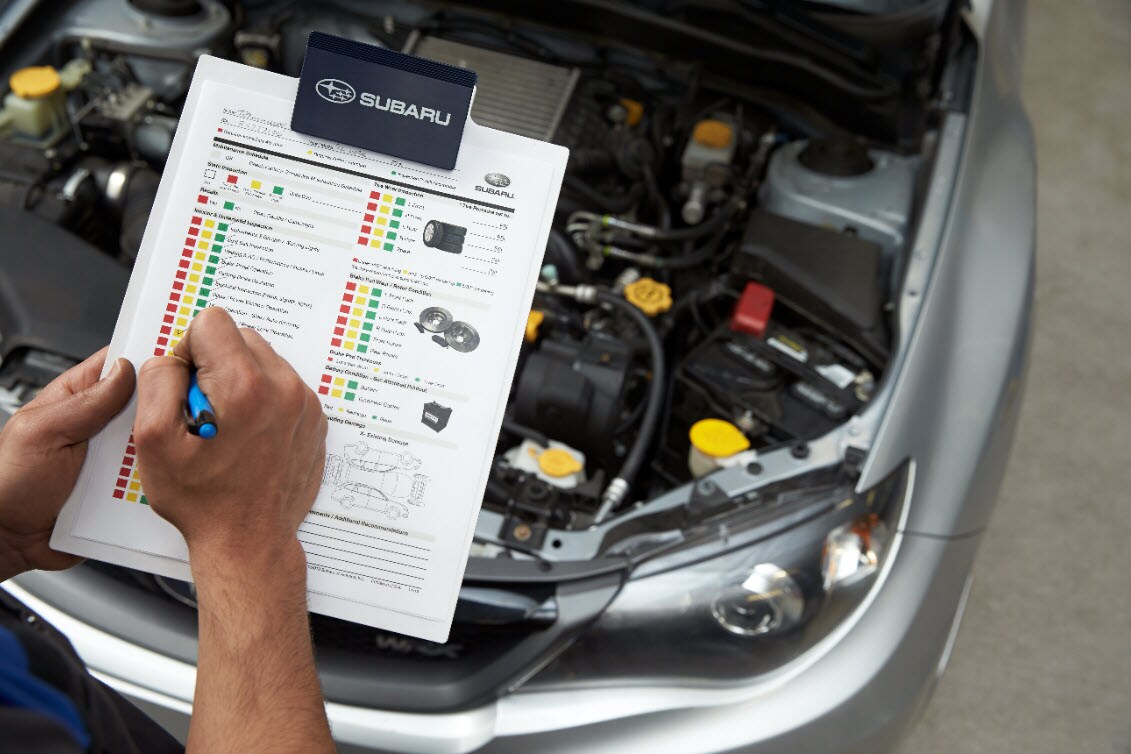 Subaru Engine Oil and other Engine Fluid Yellow Reservoir Caps.jpg Image of maintenance checklist and Yellow Engine Fluid caps under the hood of your Subaru