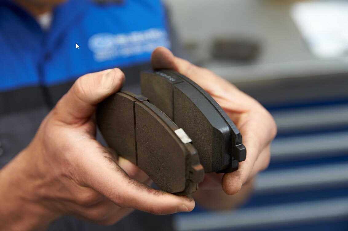 Subaru Brake Pads showing break pad worn versus new.jpg Image of Subaru Brake Pads showing worn break pad versus new