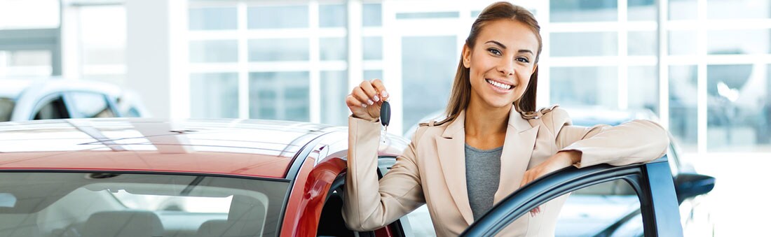 Woman-in-showroom-with-new-red-car-lg.jpg