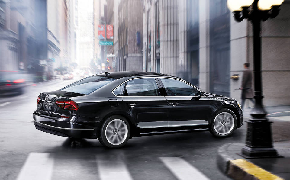 Test Drive a 2018 VW Passat A black 2018 Volkswagen Passat turning a corner