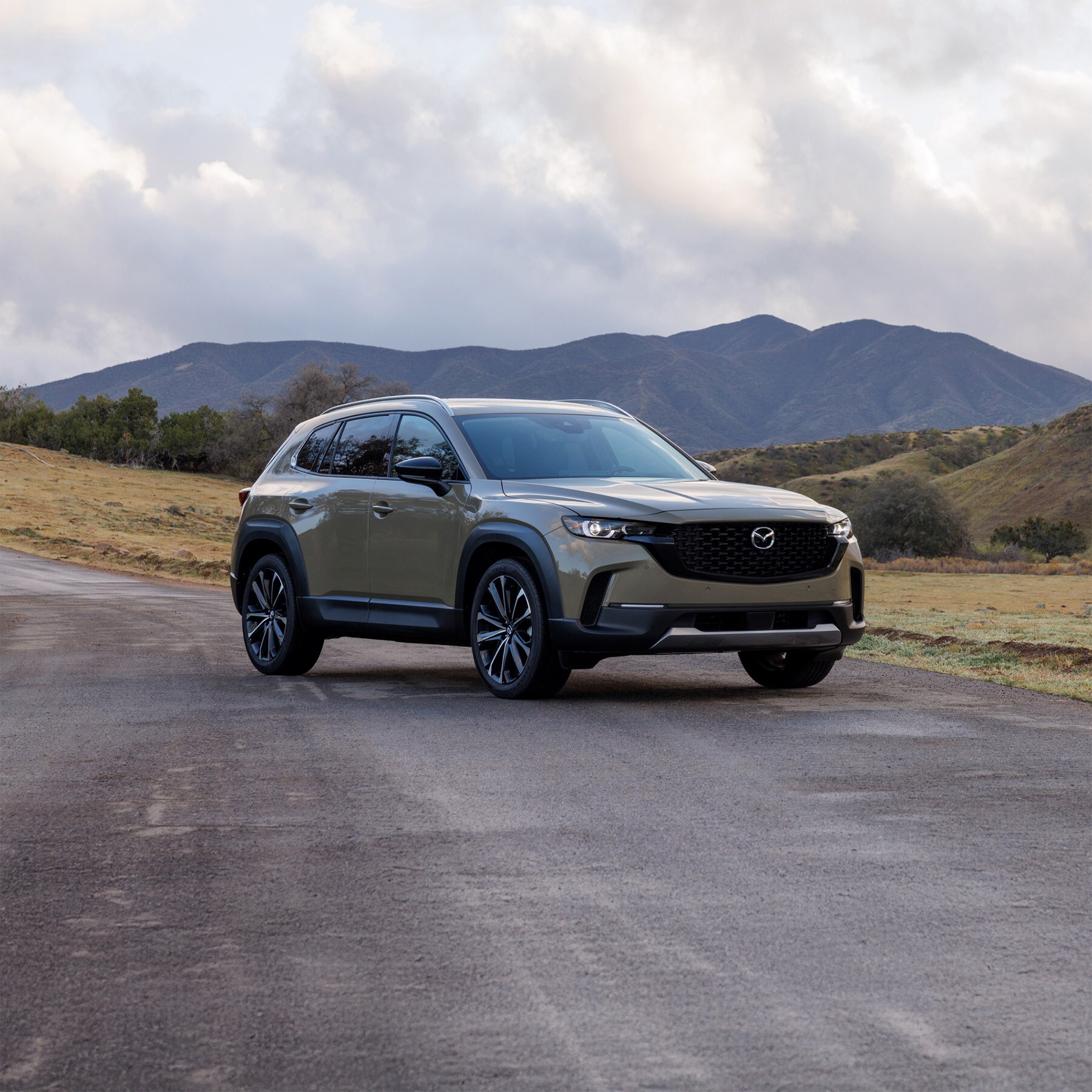 2026-mazda-cx-50-ext-posed-on-the-road-generativefill.jpg 2026 Mazda CX-50 exterior image
