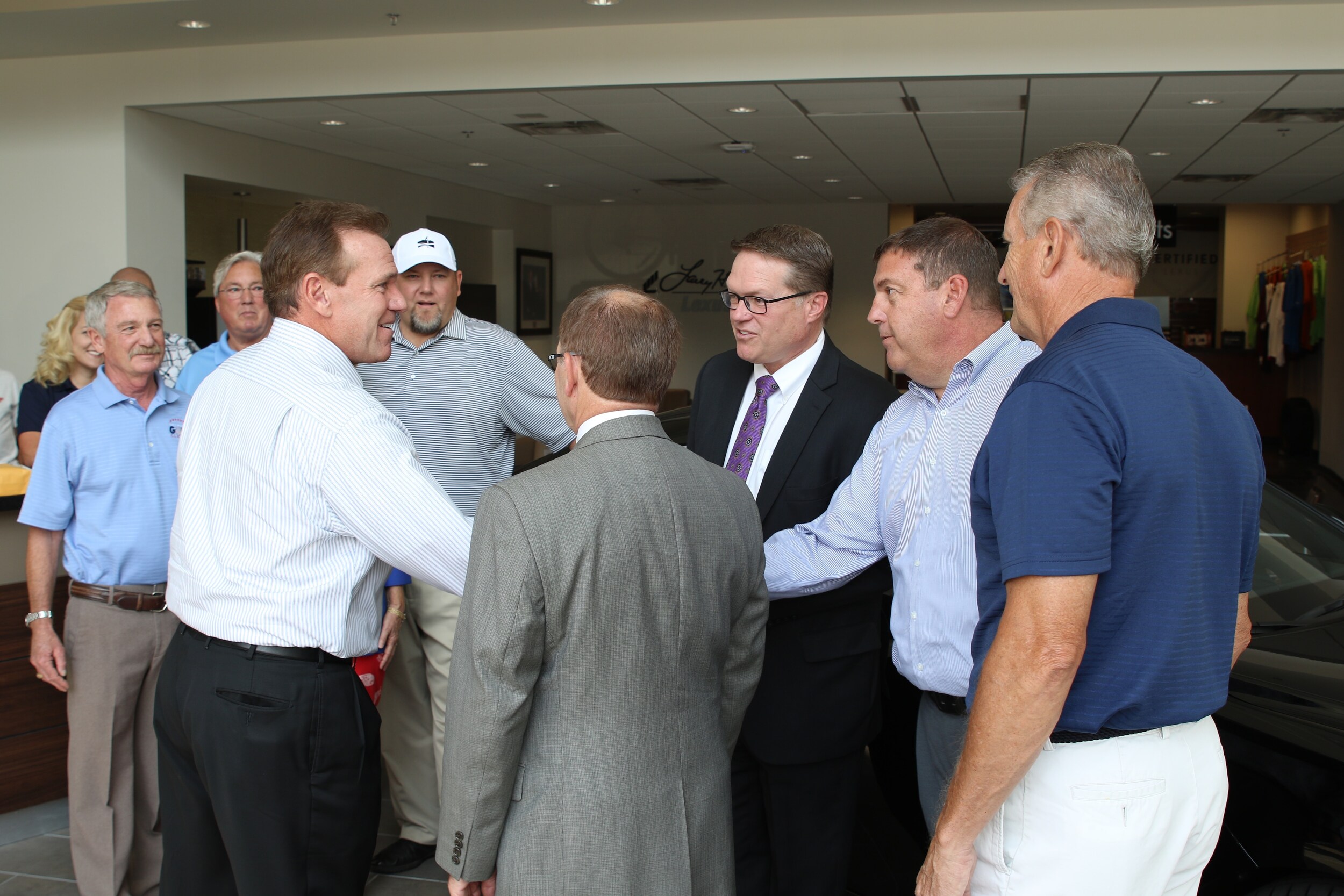 Larry H. Miller Managers from Lexus, Hyundai, Toyota and Honda congratulate the Dan Kleckner Charity