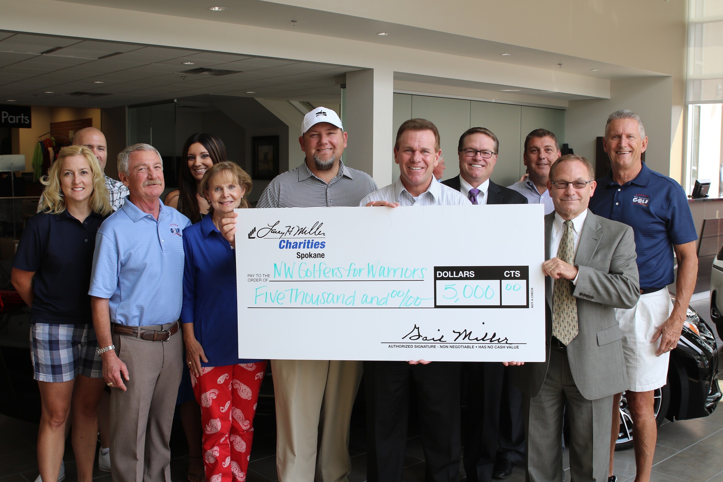 Larry H. Miller Charities donates money to Wounded Warrior