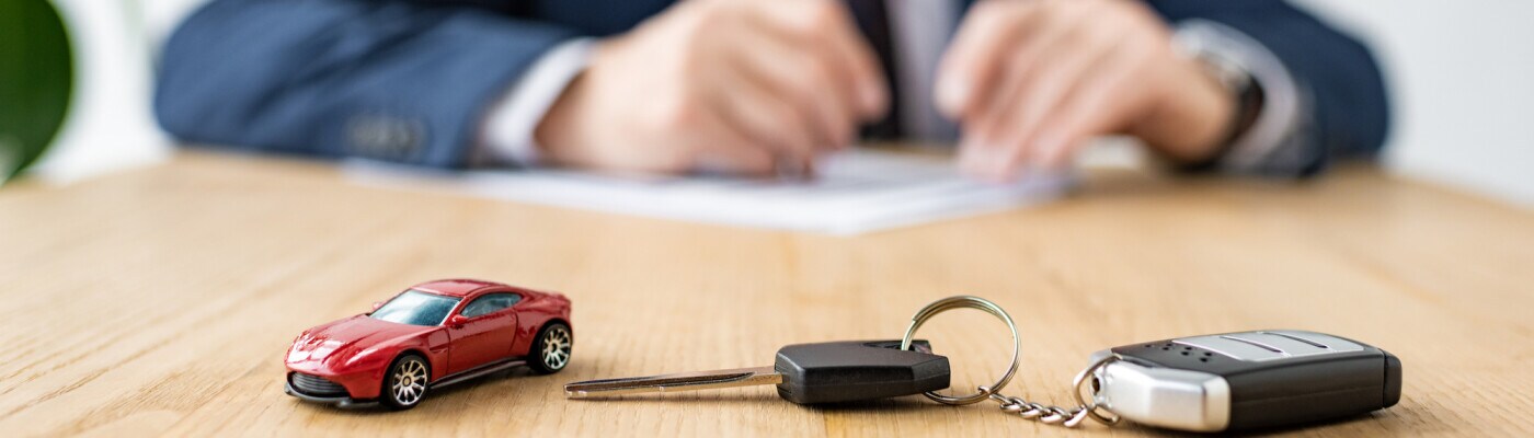 Toy car next to car keys