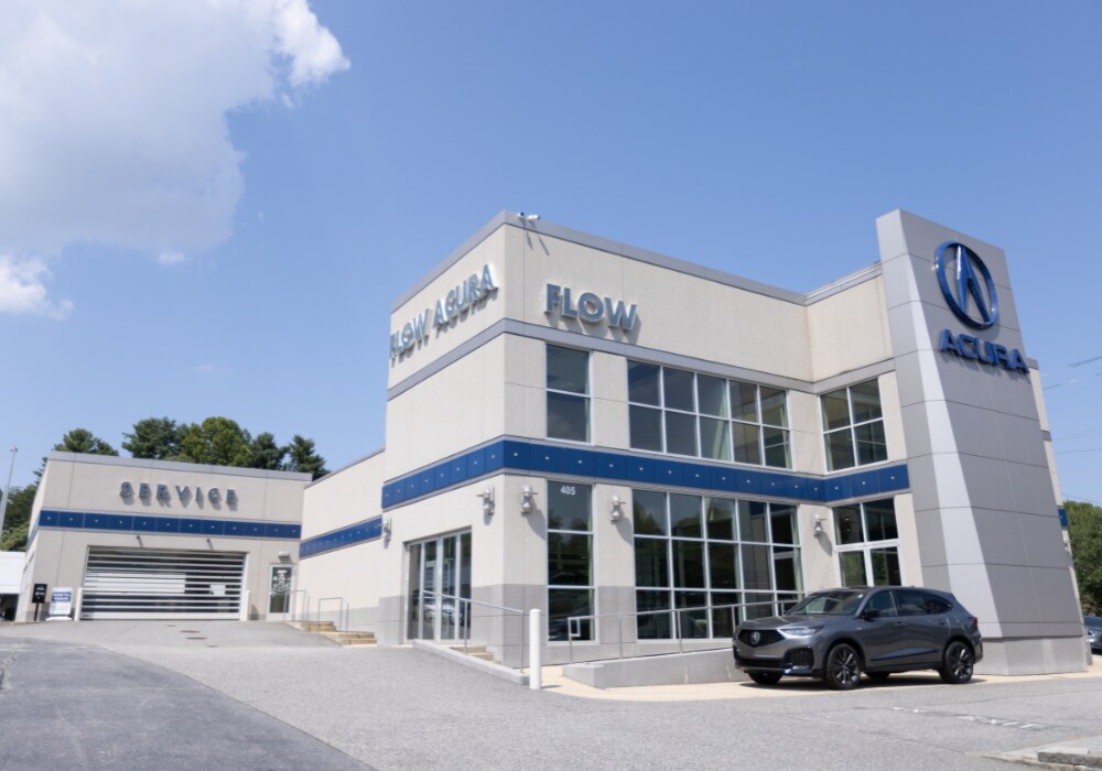 new-acura-cars-for-sale-winston-salem.png Acura SUV parked outside an Acura dealership in Winston-Salem. There is a blue sky in the background