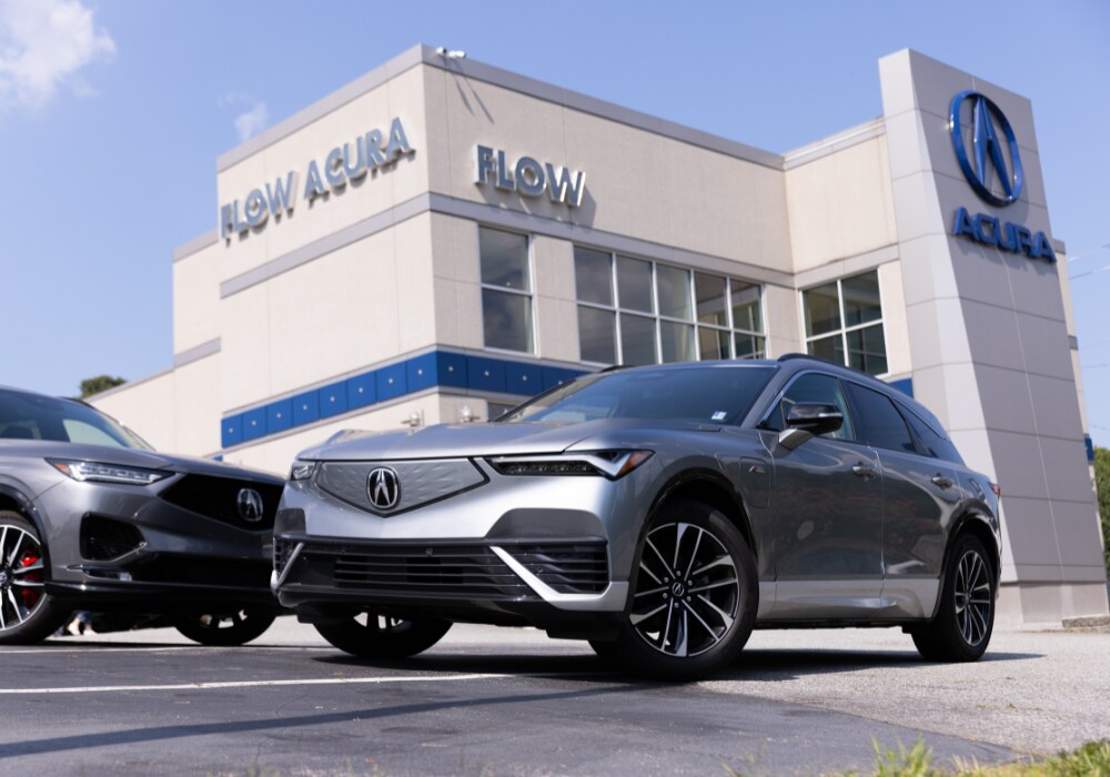 acura-certified-preowned-inventory.png Two Acura SUVs parked out front of the Flow Acura dealership