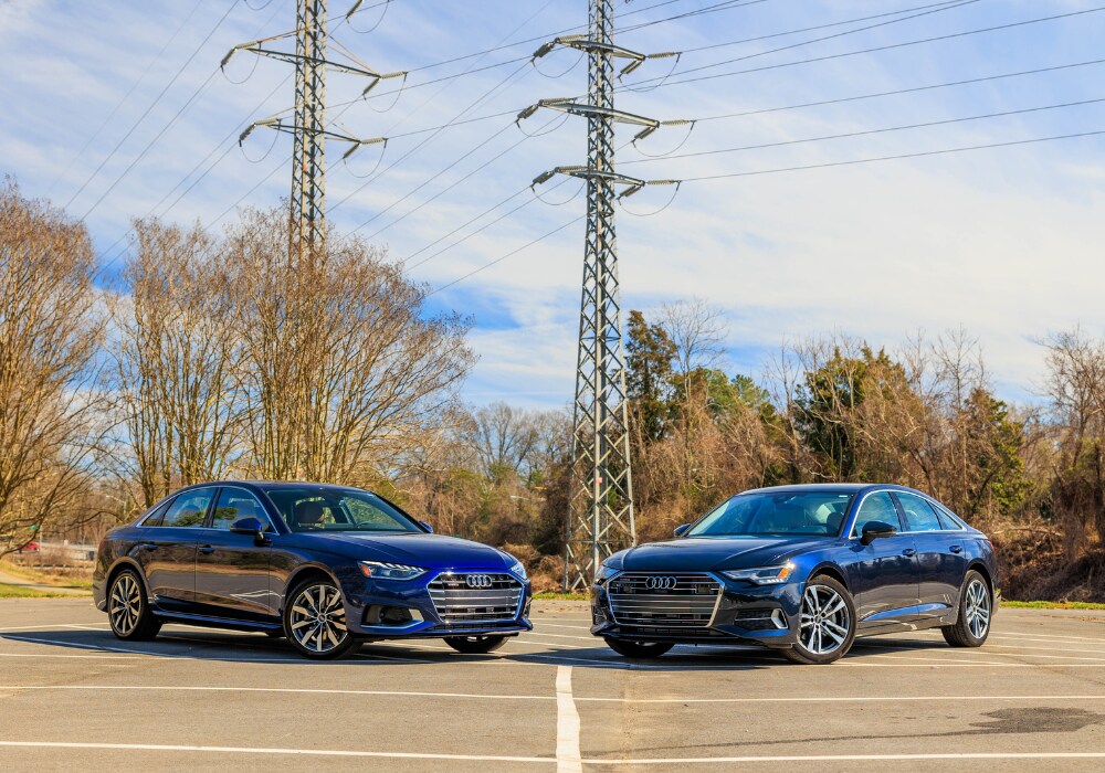 audi-sedans-charlottesville.png Two new Audi cars parked next to each other in a paved lot in Charlottesville, VA