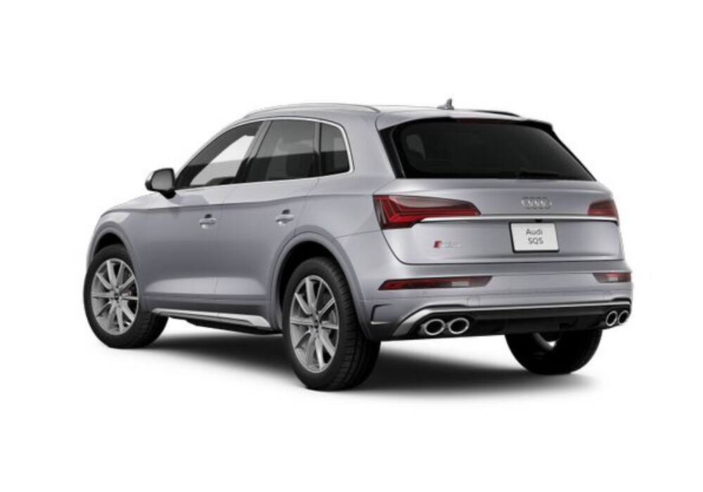 2024-audi-sq5.png Stock image from the back left angle of a new 2024 SQ5 Audi SUV with the Audi logo visible on the back of the car