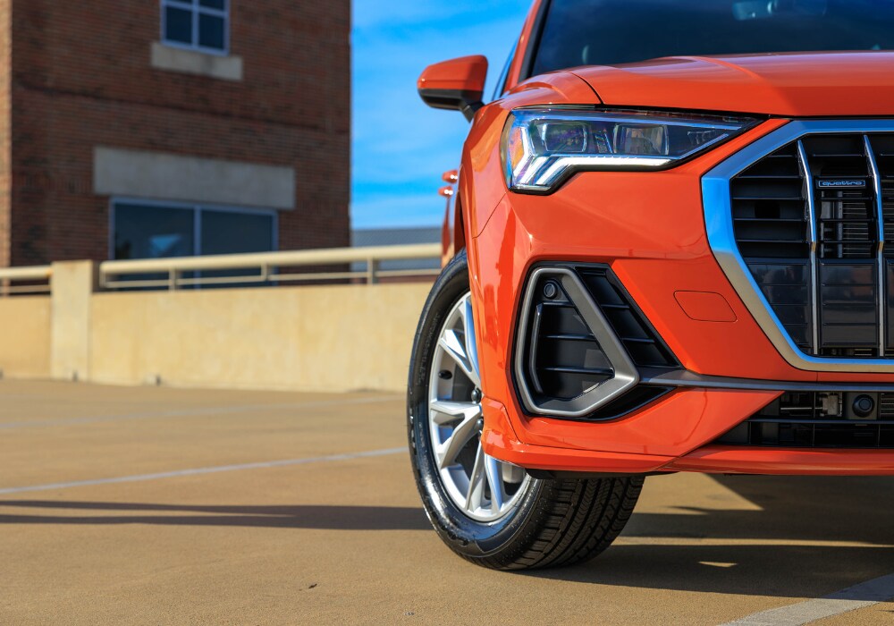 Close up photo of a 2024 Audi Q4 SUV. Photo shows the front left grille of the car