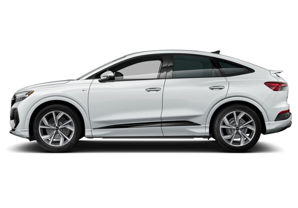 audi-e-tron-q5-sportback.png A side view of a white 2024 Audi Q4 Sportback e-tron for sale in Greensboro, showcasing its sleek and sporty design with large wheels, black accents, and a sloping roofline.