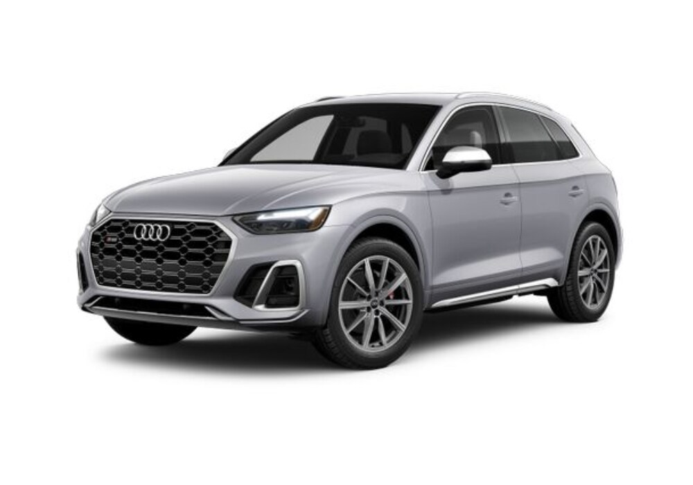 audi-sq5-for-sale.png A front view of a silver 2024 Audi SQ5 SUV for sale in Greensboro. It has a bold, aggressive design with large LED headlights, a prominent black honeycomb grille, and a muscular stance.