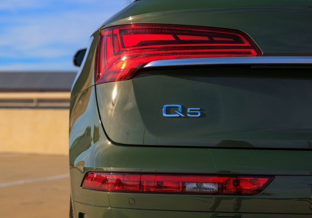 audi-q5-greensboro.png Close up shop of a 2024 Audi Q5 SUV. Photo shows the rear of the car with the Q5 logo visible