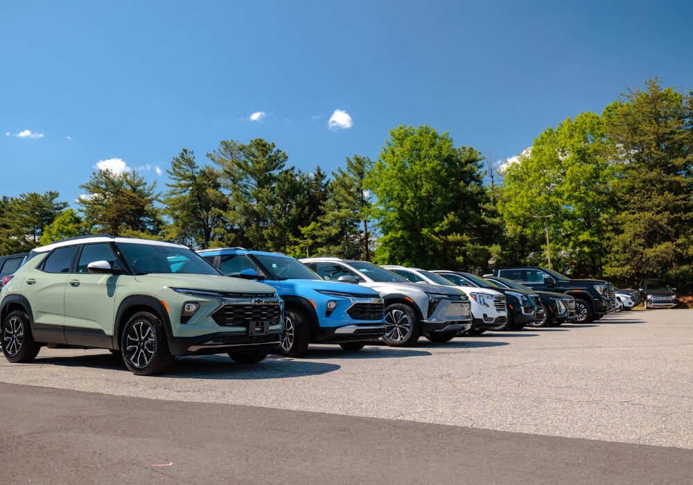 new-chevy-cars-for-sale-winston-salem.png A lineup of Chevrolet SUVs parked in the lot of the Flow Chevrolet Buick GMC dealership located in Winston-Salem, NC