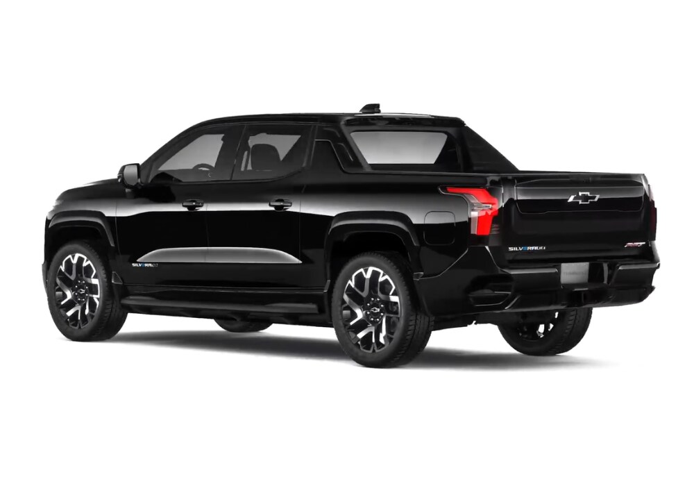 chevy-silverado-ev-for-sale.png Stock photo of a black Chevy Silverado EV pickup truck. Photo taken from the back left angle and shows the Chevy logo on the rear