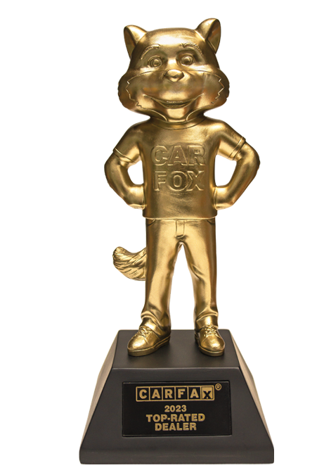 2023-carfax-top-rated-dealer.webp A golden statue of the Carfax mascot, a plaque a the bottom reads Carfax 2023 top rated dealer
