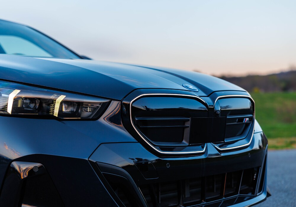 bmw-i5-for-sale.png Close up shot of the front grille of a new BMW i5. BMW logo is visible of the front grille of the car.