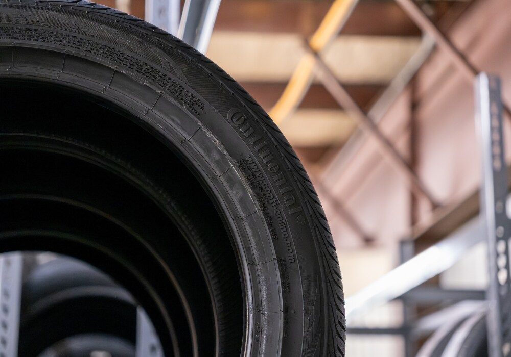 tires-for-bmw-winston-salem.png Close up photo of the side of a Continental tire in the Flow BMW parts center