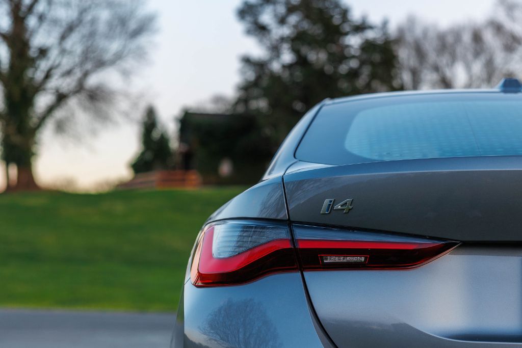 bmw-i4-for-sale.jpg Close-up view of a silver 2024 BMW i4, focused in on the back bumper