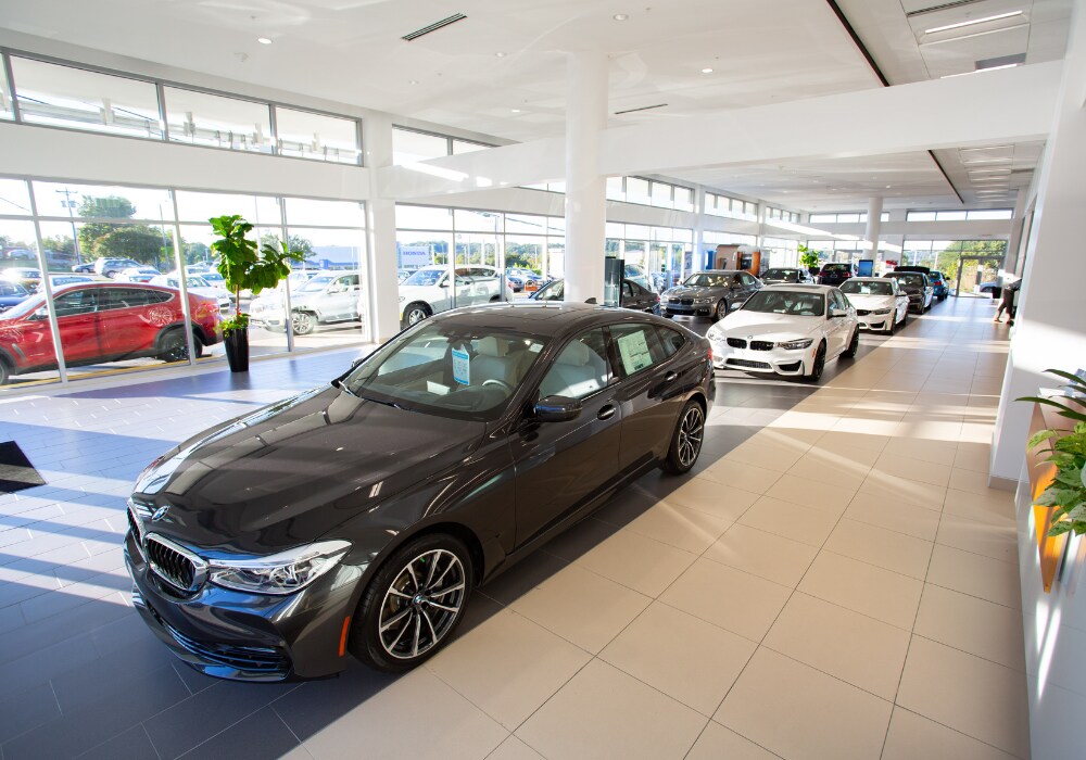 bmw-dealership-winston-salem-nc.png new BMW cars parked inside the showroom of a BMW dealership located in Winston-Salem, NC