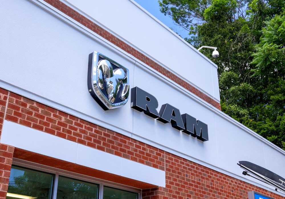 ram-dealership-near-richmond-va.png The Ram logo on the front of the Flow Chrysler Dodge Jeep Ram of Charlottesville.