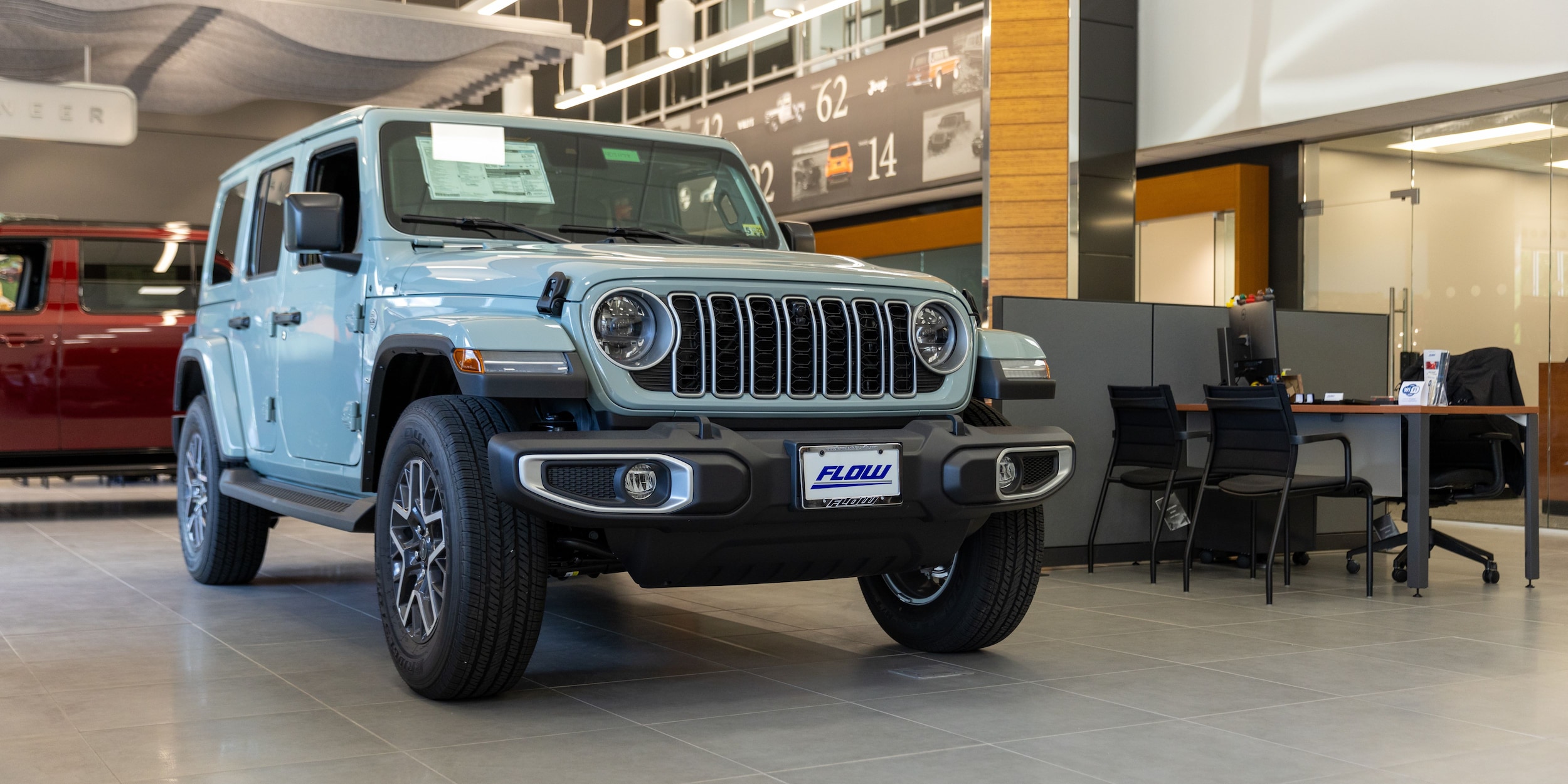 flow-cdjr-charlottesville-showroom.jpg A jeep vehicle sitting on the showroom floor at CDJR Charlottesville