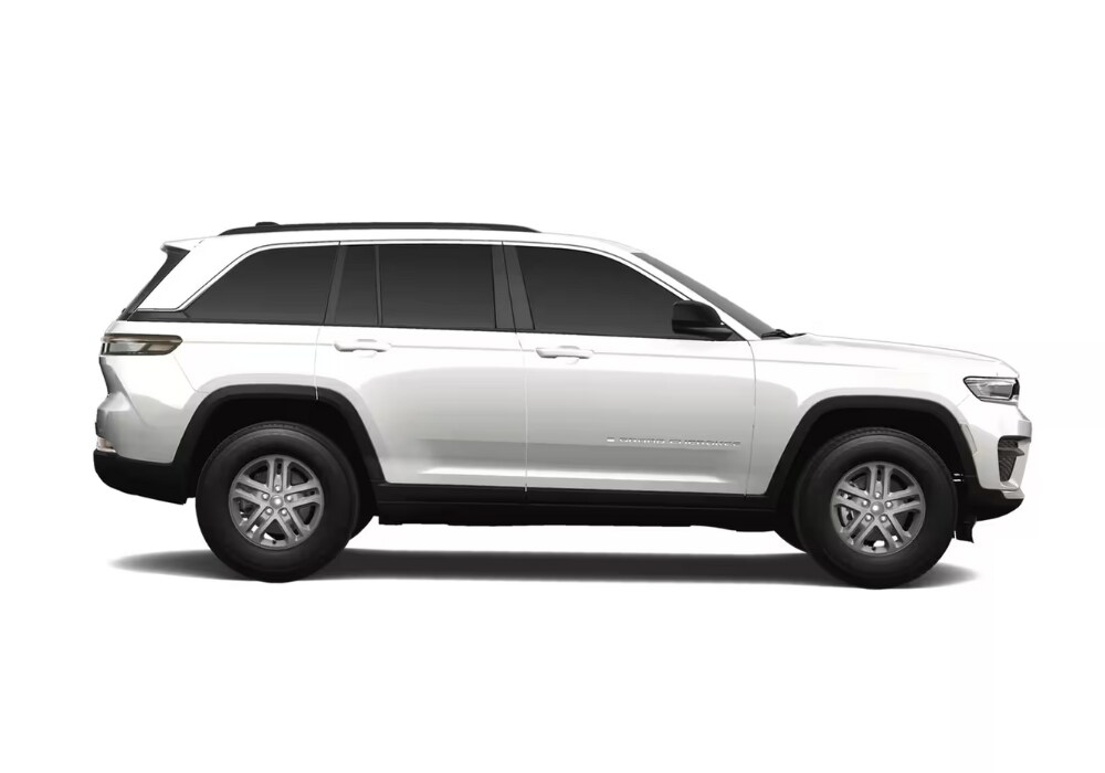 jeep-grand-cherokee-for-sale-charlottesville.png Side view of a white Jeep Grand Cherokee SUV in front of a white background
