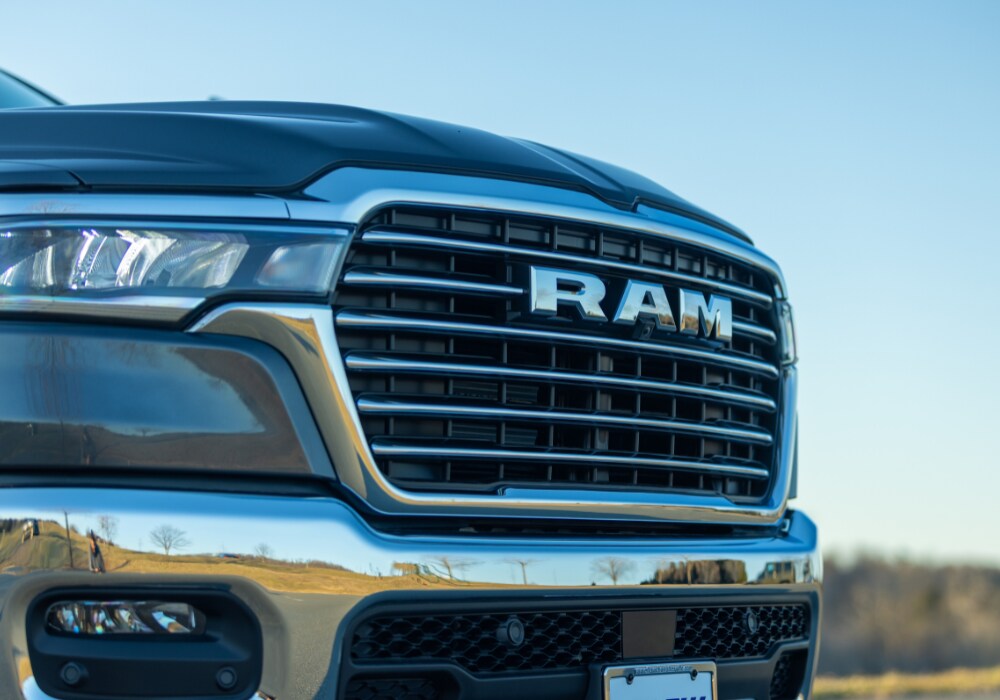 ram-truck-trim-levels.png Close up photo of the front grille of a Ram 1500 truck for sale in Charlottesville