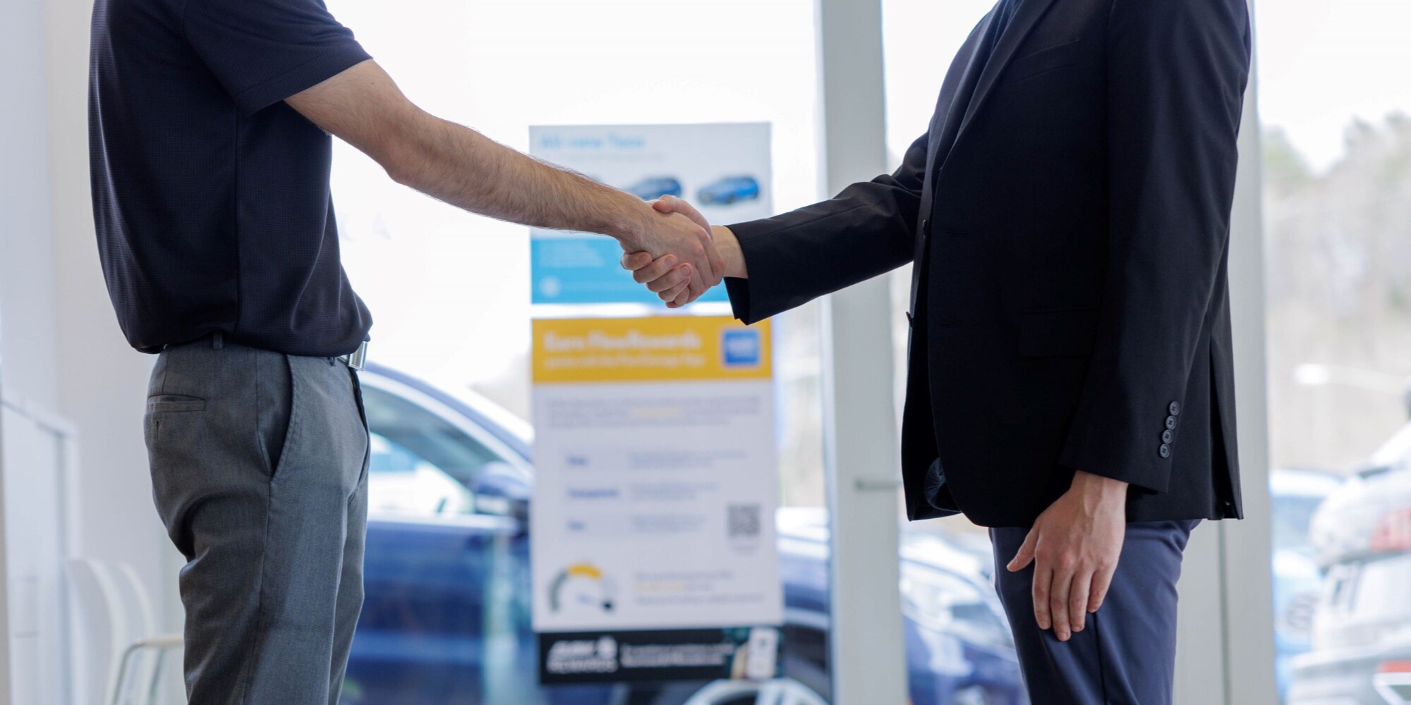Flow_handshake_SEO.png Tow people shaking hands at Flow Volkswagen dealership in Burlington, NC. Located near Mebane, Greensboro, and Hillsborough.