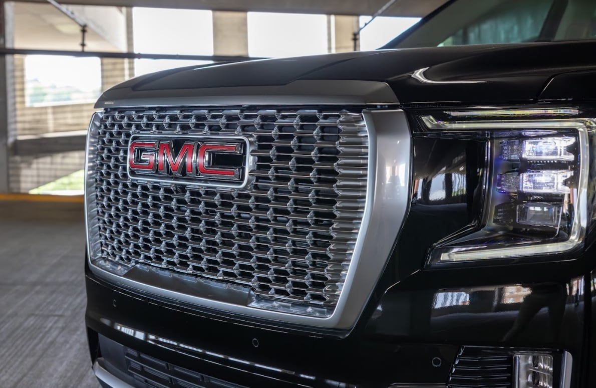 gmc-yukon-for-sale-greensboro.png Front grille of a black 2024 GMC Yukon Denali available for purchase at Flow Buick GMC Greensboro