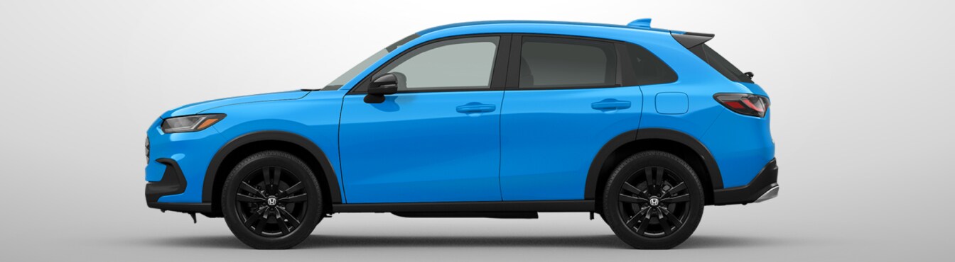Exterior side view of a 2027 HR-V in x parked agaisnt a light gray background