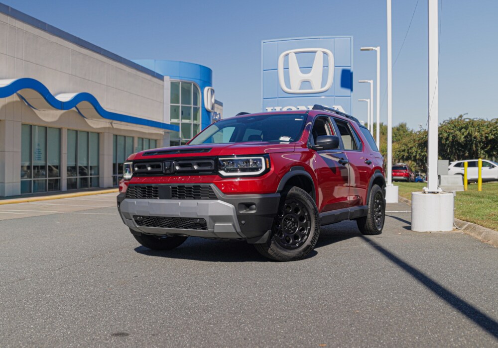 honda-passport-rtl-blackout.png Red Honda Passsport RTL Blackout trim parked in front of the Flow Honda in Winston-Salem dealership
