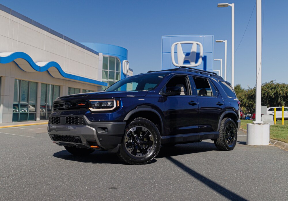 honda-passport-trailsport-elite.png Dark blue Honda Passport Trailsport Elite parked in front of the Flow Honda dealership in Winston-Salem, NC