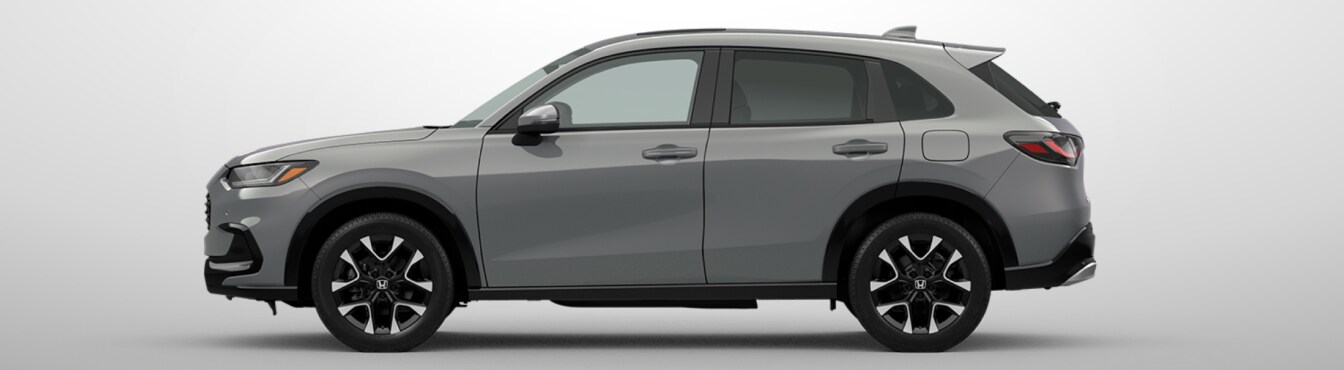 Exterior side view of a 2027 HR-V in x parked agaisnt a light gray background