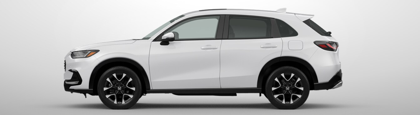 Exterior side view of a 2027 HR-V in x parked agaisnt a light gray background