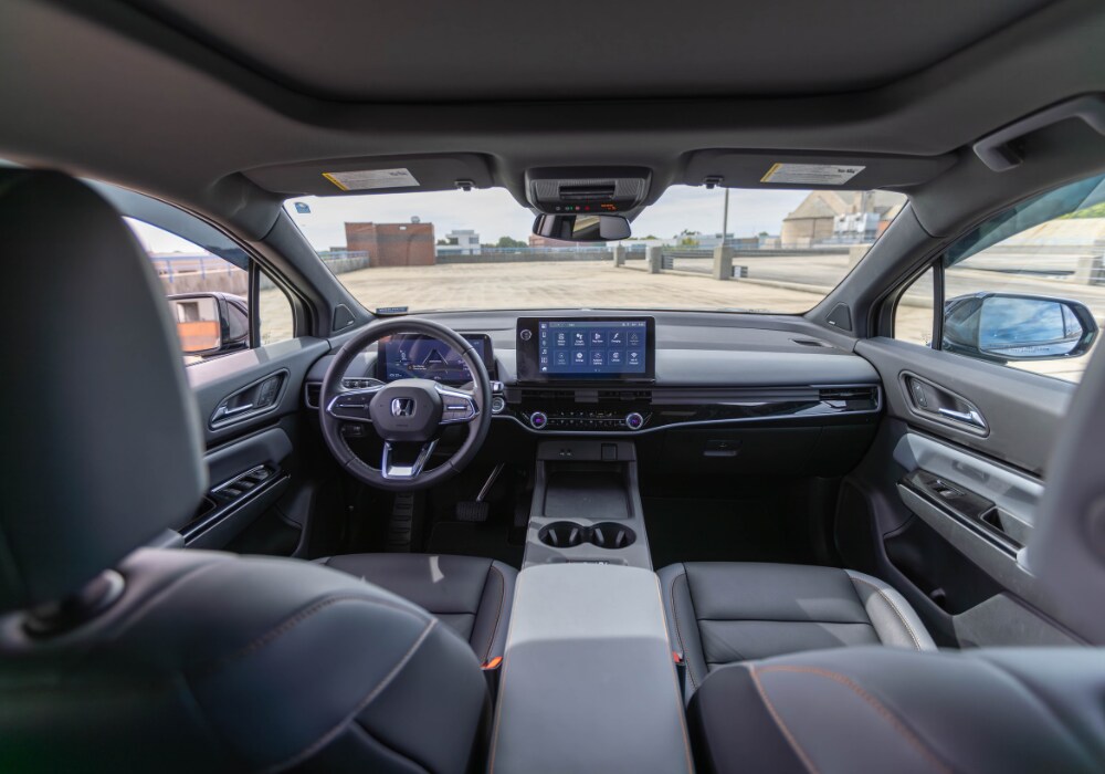 2024-honda-prologue-interior.jpg Photo shows the interior of a 2024 Honda Prologue with navigation and infotainment lit up on the front dash