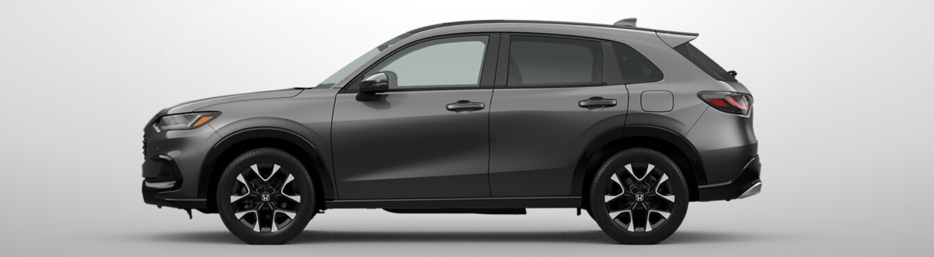 Exterior side view of a 2027 HR-V in x parked agaisnt a light gray background