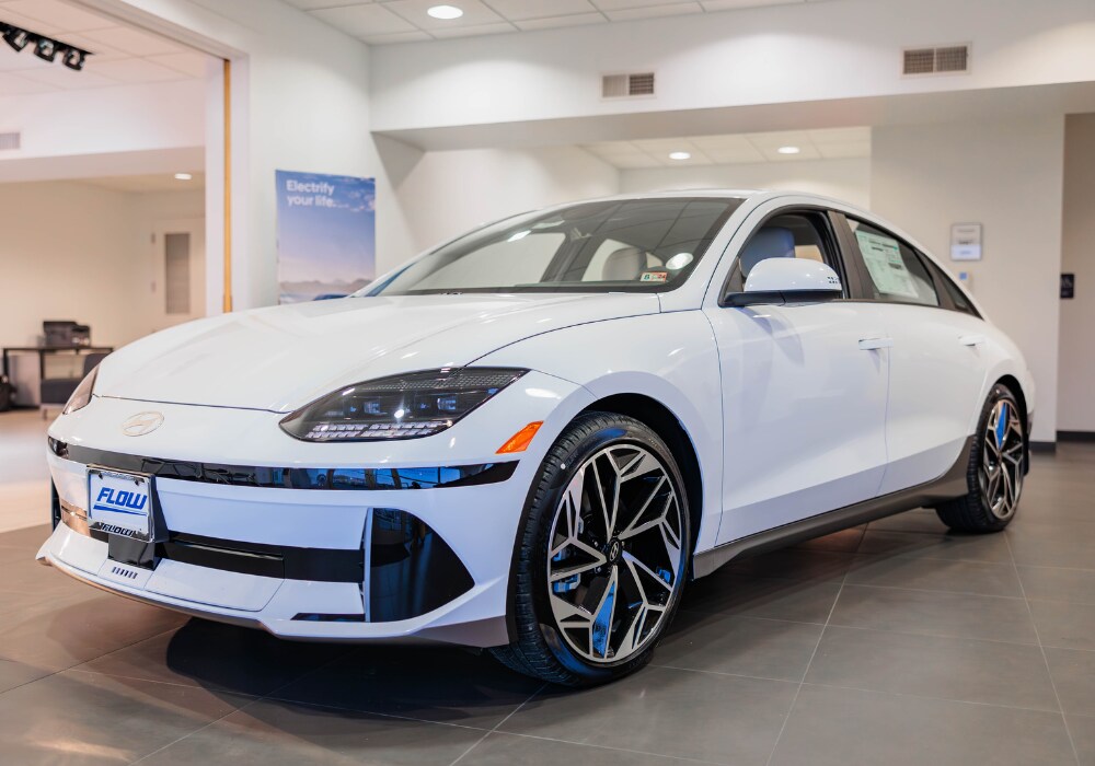 new-hyundai-cars-for-sale-charlottesville.png White Hyundai car for sale parked inside the showroom of Flow Hyundai of Charlottesville