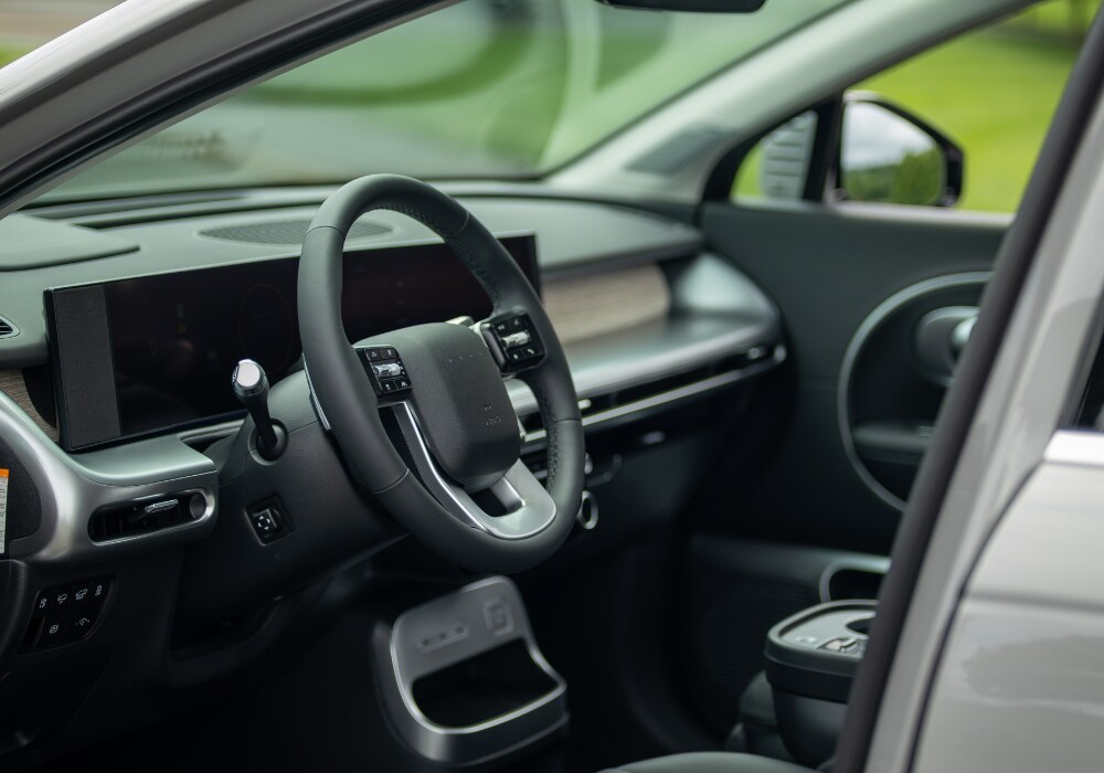 hyundai-ioniq-9-electric-suv.png Hyundai IONIQ 9 interior including the steering wheel and front dash