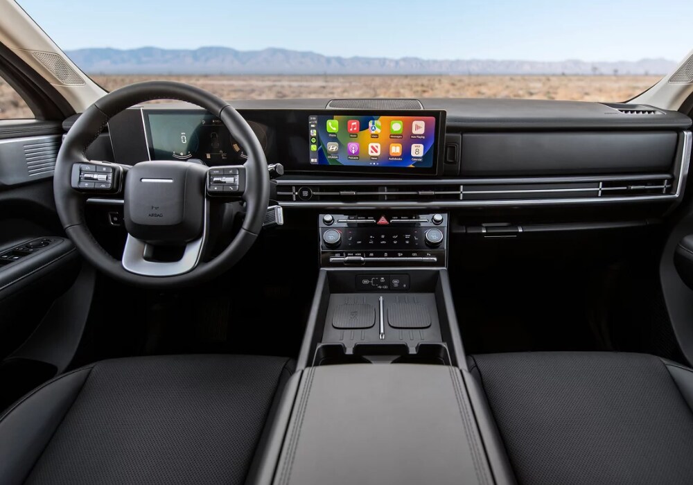2024-hyundai-santa-fe-interior.png 2024 Hyundai Santa Fe interior with Apple CarPlay visible on front dash