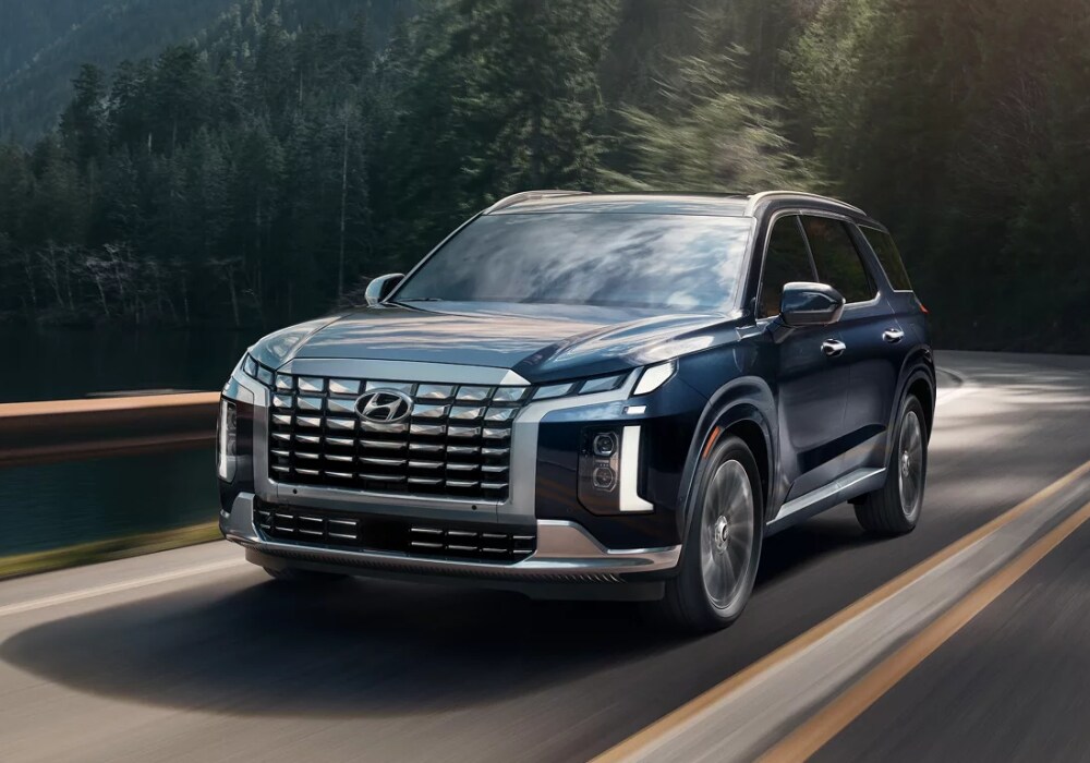hyundai-palisade-for-sale.png 2024 Hyundai Palisade driving down a highway