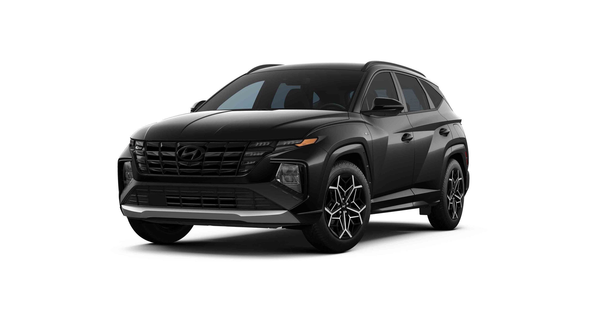 2022_Tucson_NLine_AWD_AshBlack_Black_FrontDrvrAngleWheelTurn_WhiteStudio.jpg