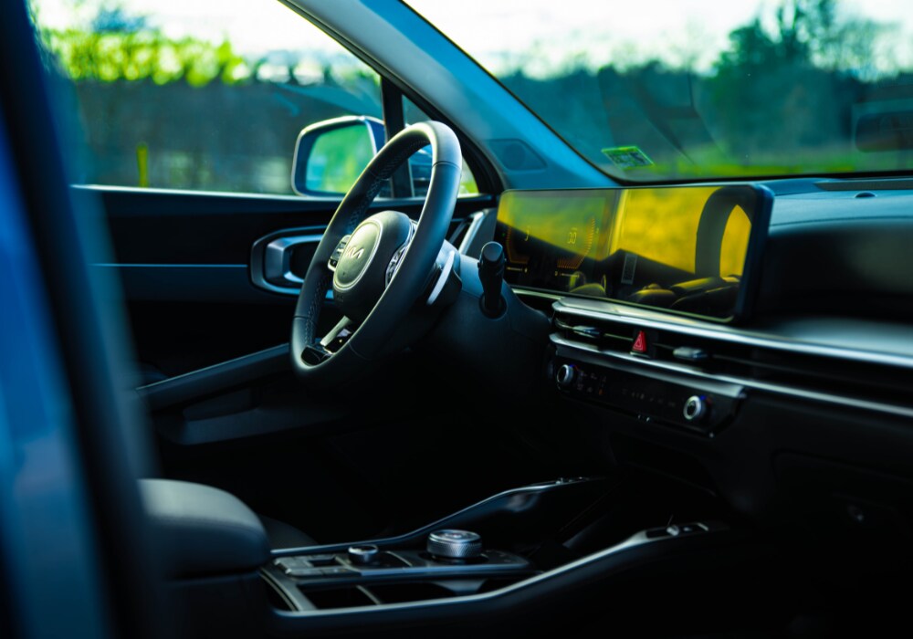2025-sorento-kia.png 2025 Kia Sorento interior showing the steering and the infotainment screen and system