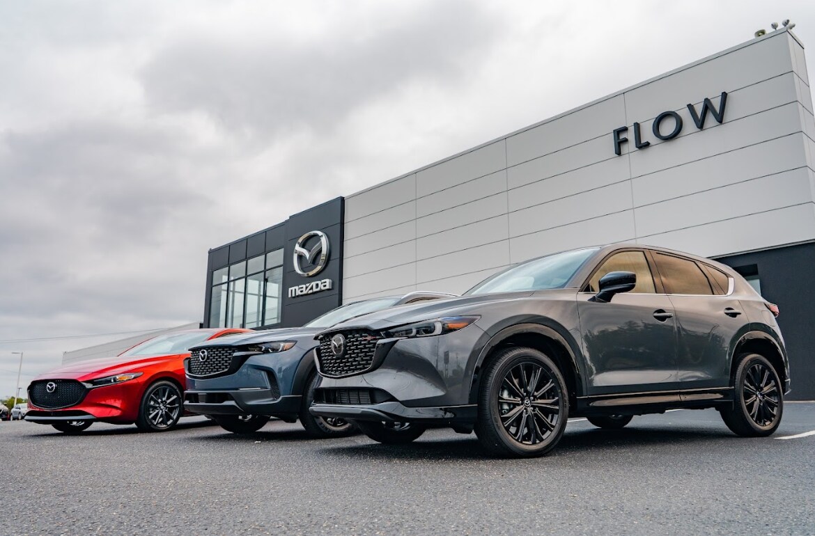 flow-mazda-fayetteville-storefront.png three Mazda vehicles in front of the Flow Mazda of Fayetteville dealership