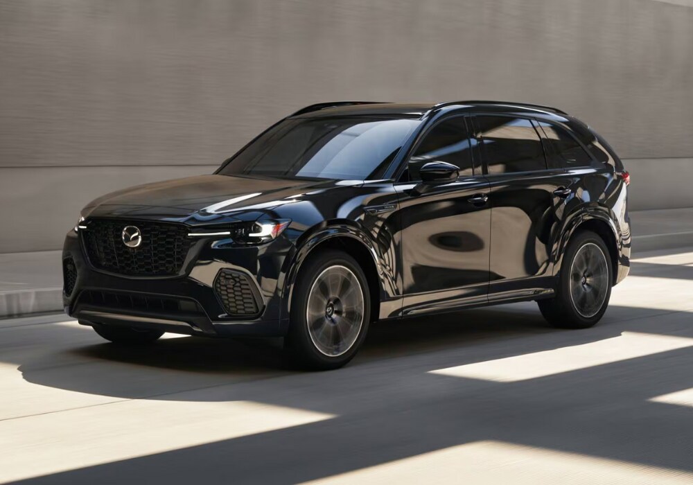 mazda-cx-70-for-sale.png Black 2025 Mazda CX-70 driving towards the camera