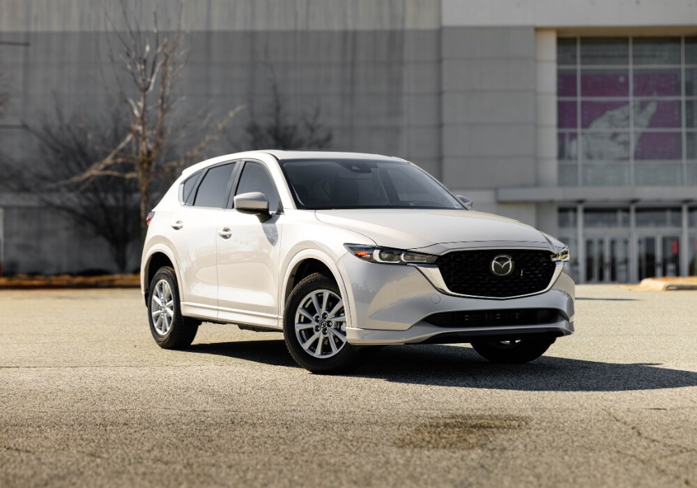 2025-mazda-cx-5-for-sale.png 2025 Mazda CX-5 parked in front of a mall in Greensboro