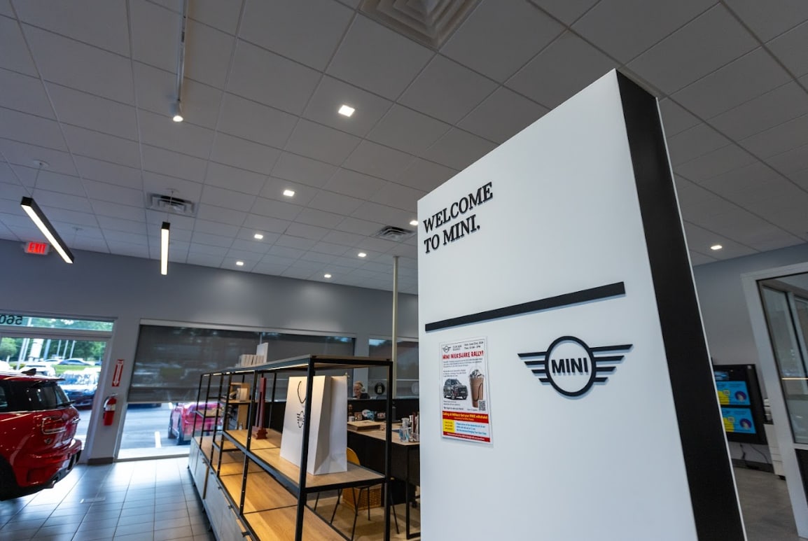 mini-raleigh-maintenance-plus.png Sign that reads Welcome To Mini inside the Flow Mini Raleigh dealership showroom