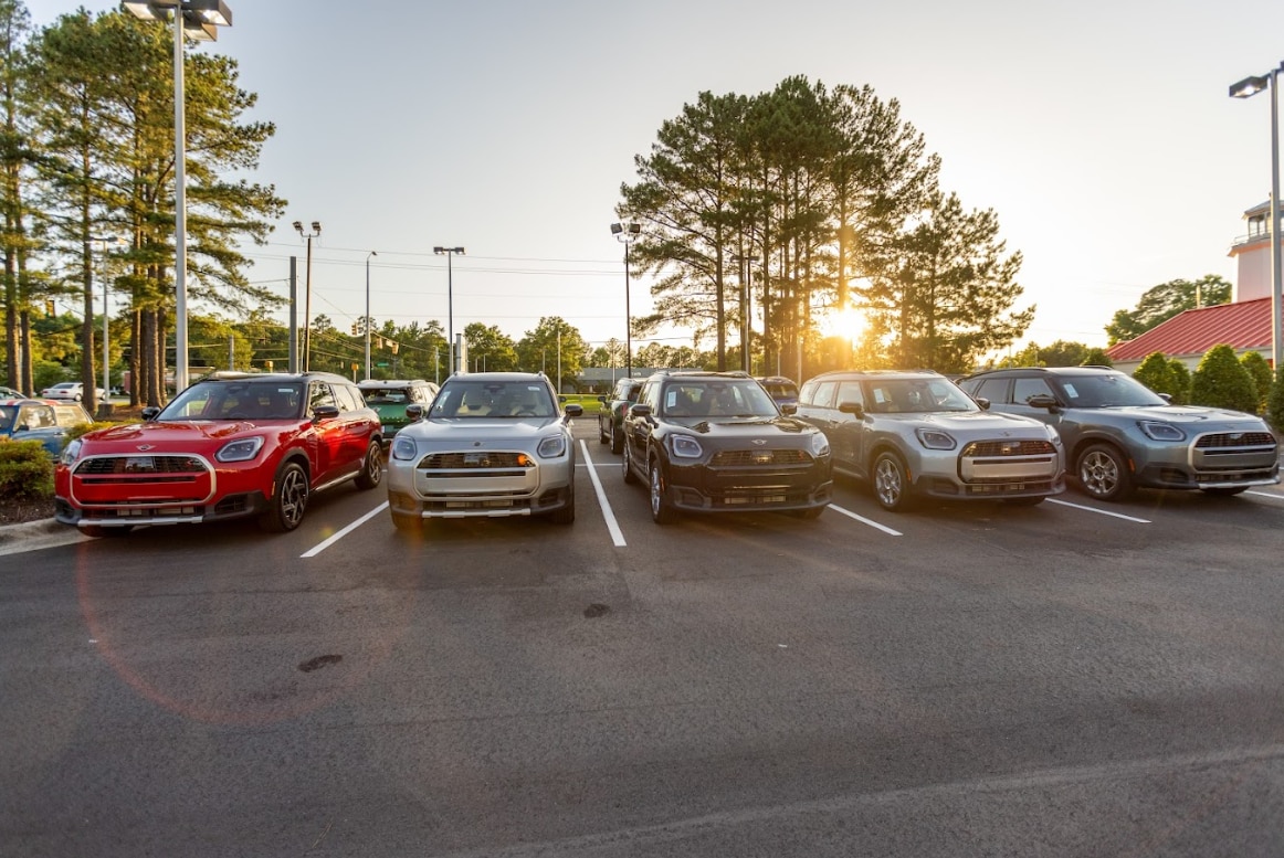 mini-cooper-vehicles-raleigh.png Lineup of MINI models for sale in the dealership lot of Flow MINI Raleigh