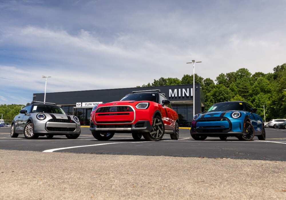 mini-dealership-winston-salem.png Three used MINI cars parked in front of the Flow MINI dealership in Winston-Salem